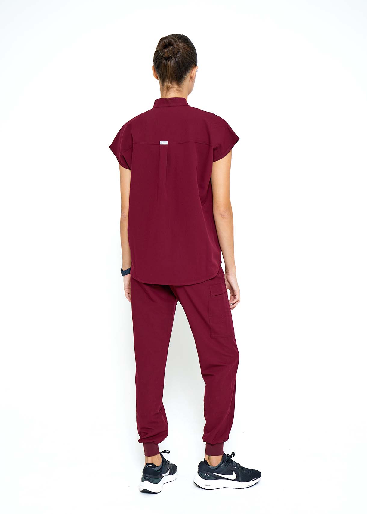 Model wearing scrubs.