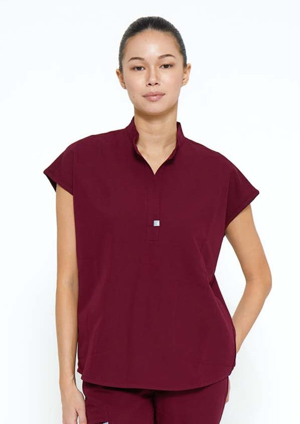Model wearing scrubs.