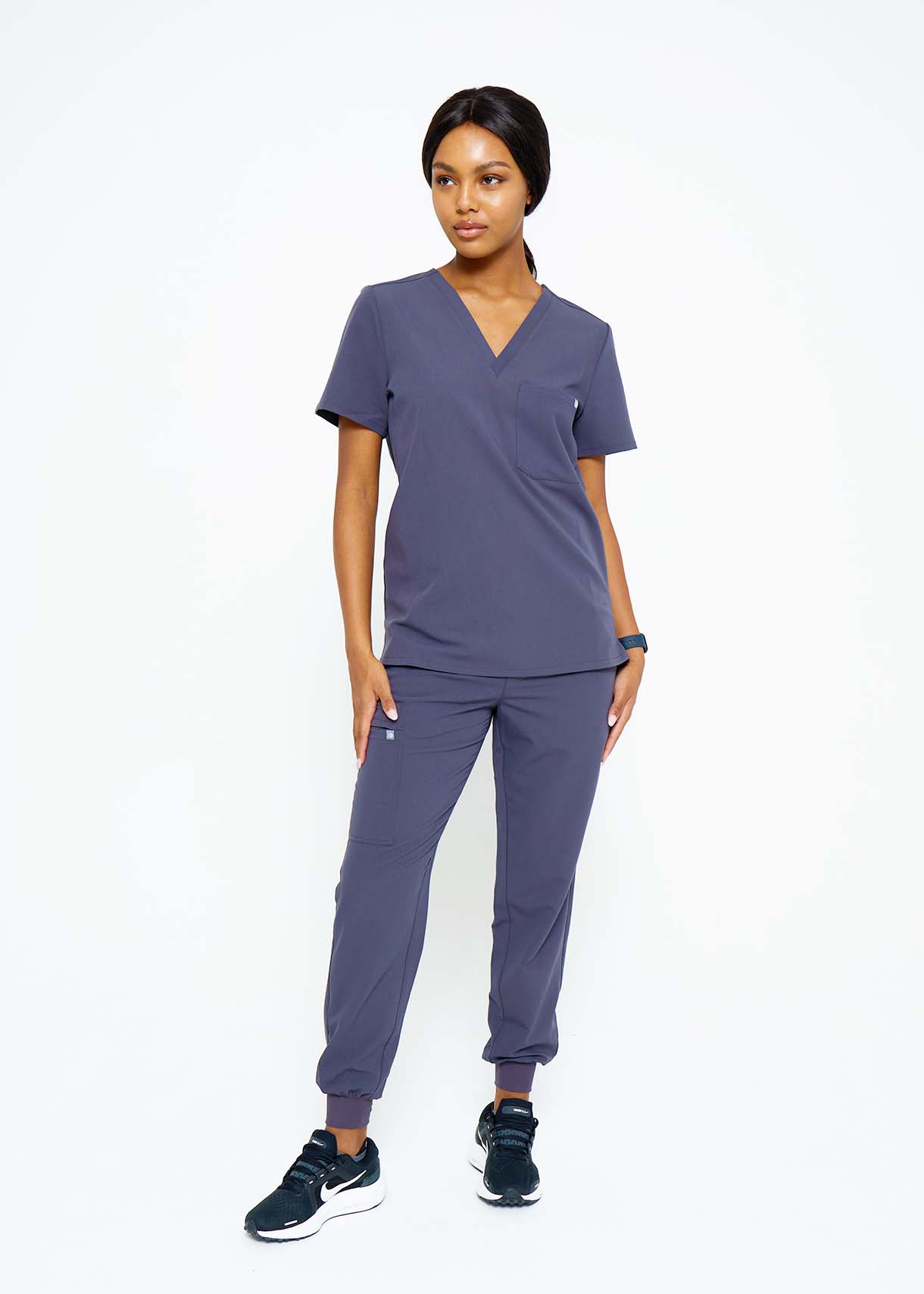 Model wearing scrubs.