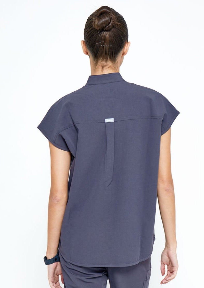 Model wearing scrubs.