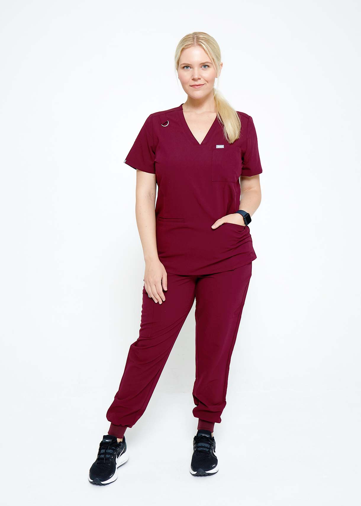 Model wearing scrubs.
