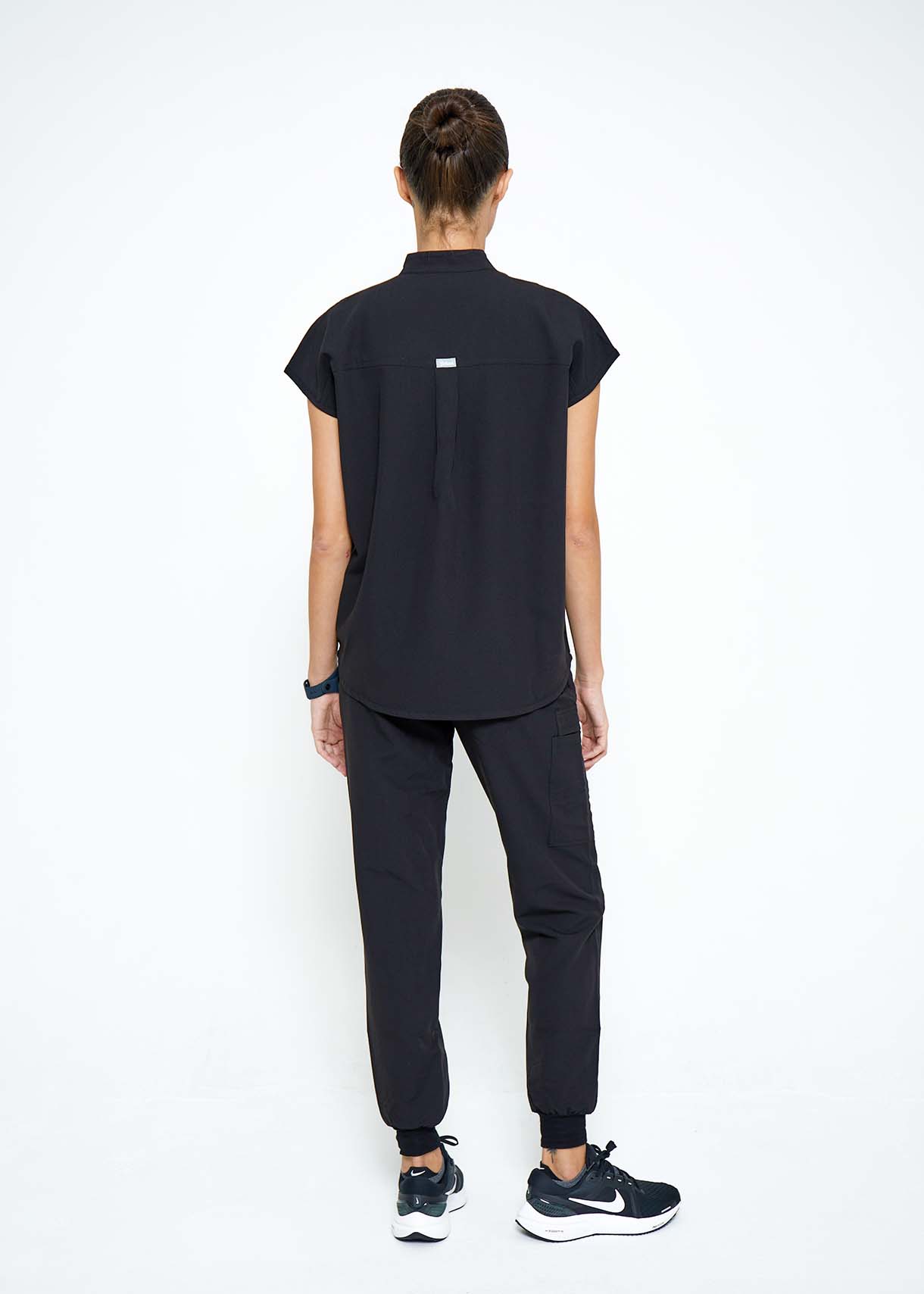 Model wearing scrubs.