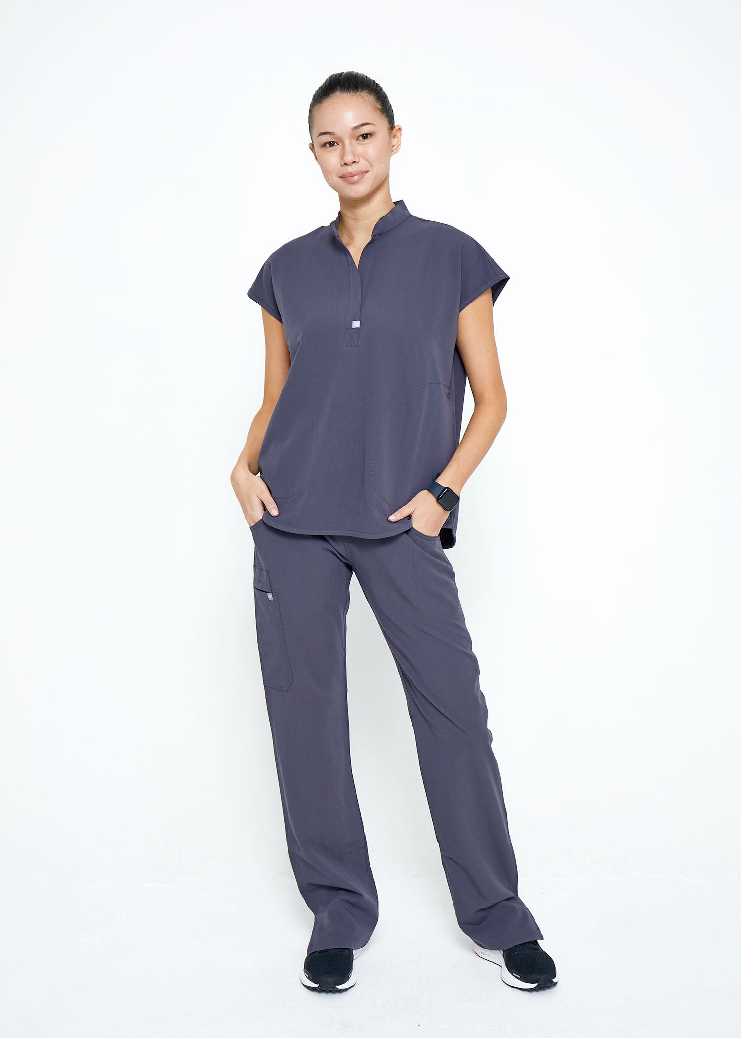 Model wearing scrubs.
