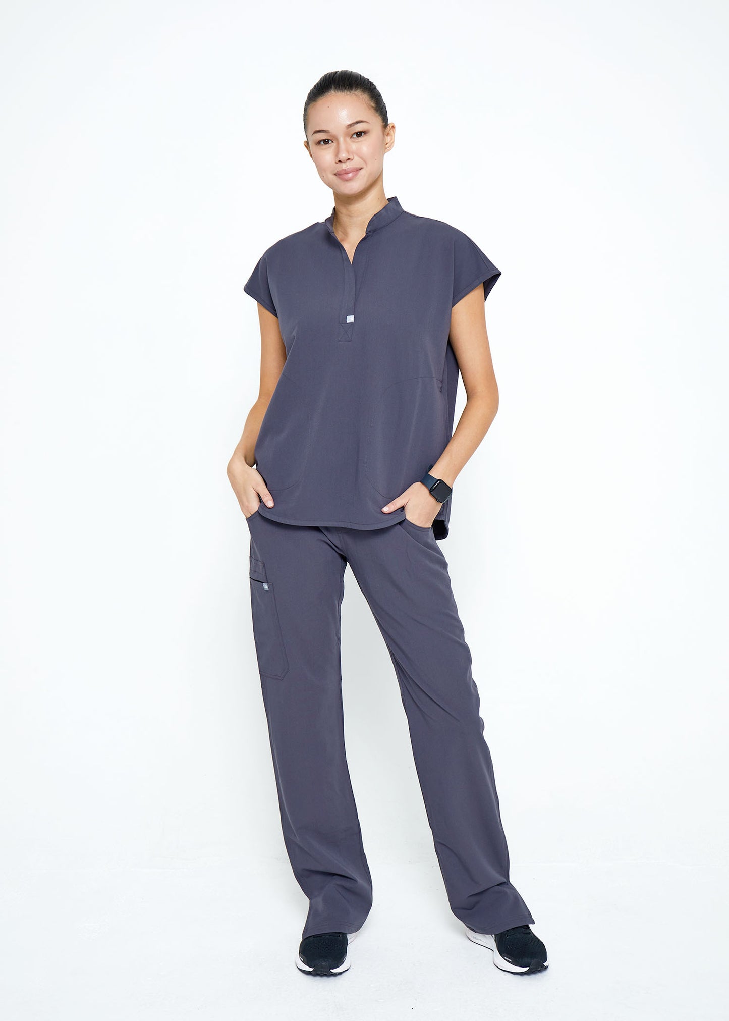 Model wearing scrubs.