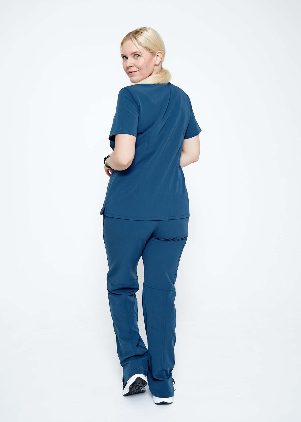 Model wearing scrubs.