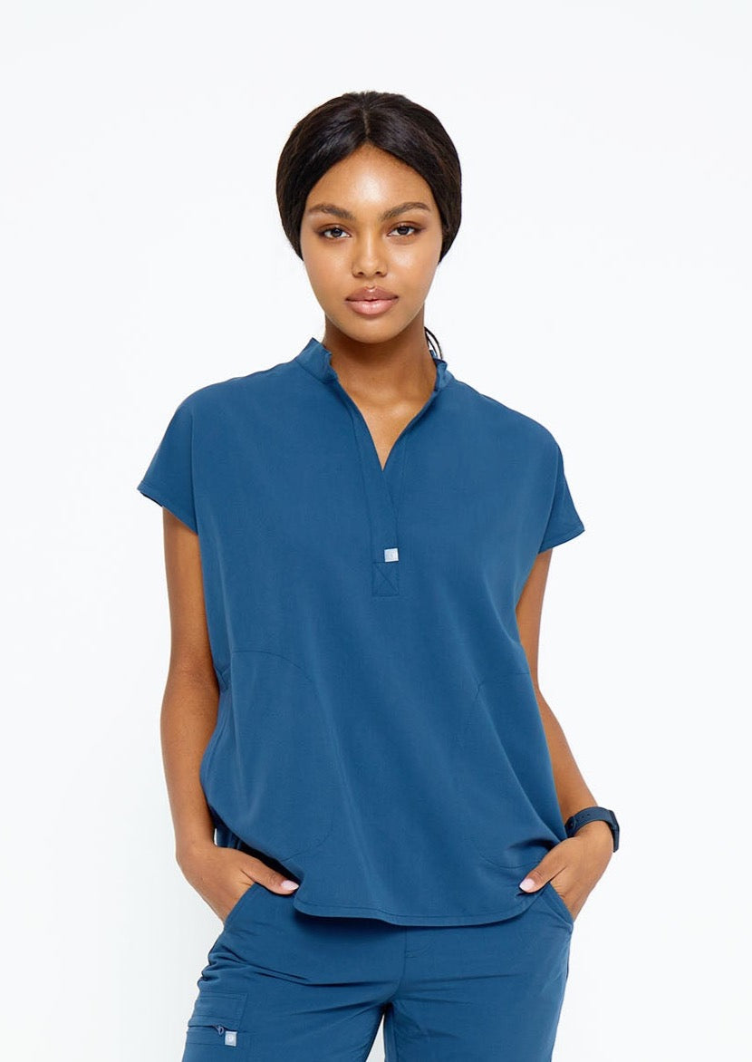 Model wearing scrubs.