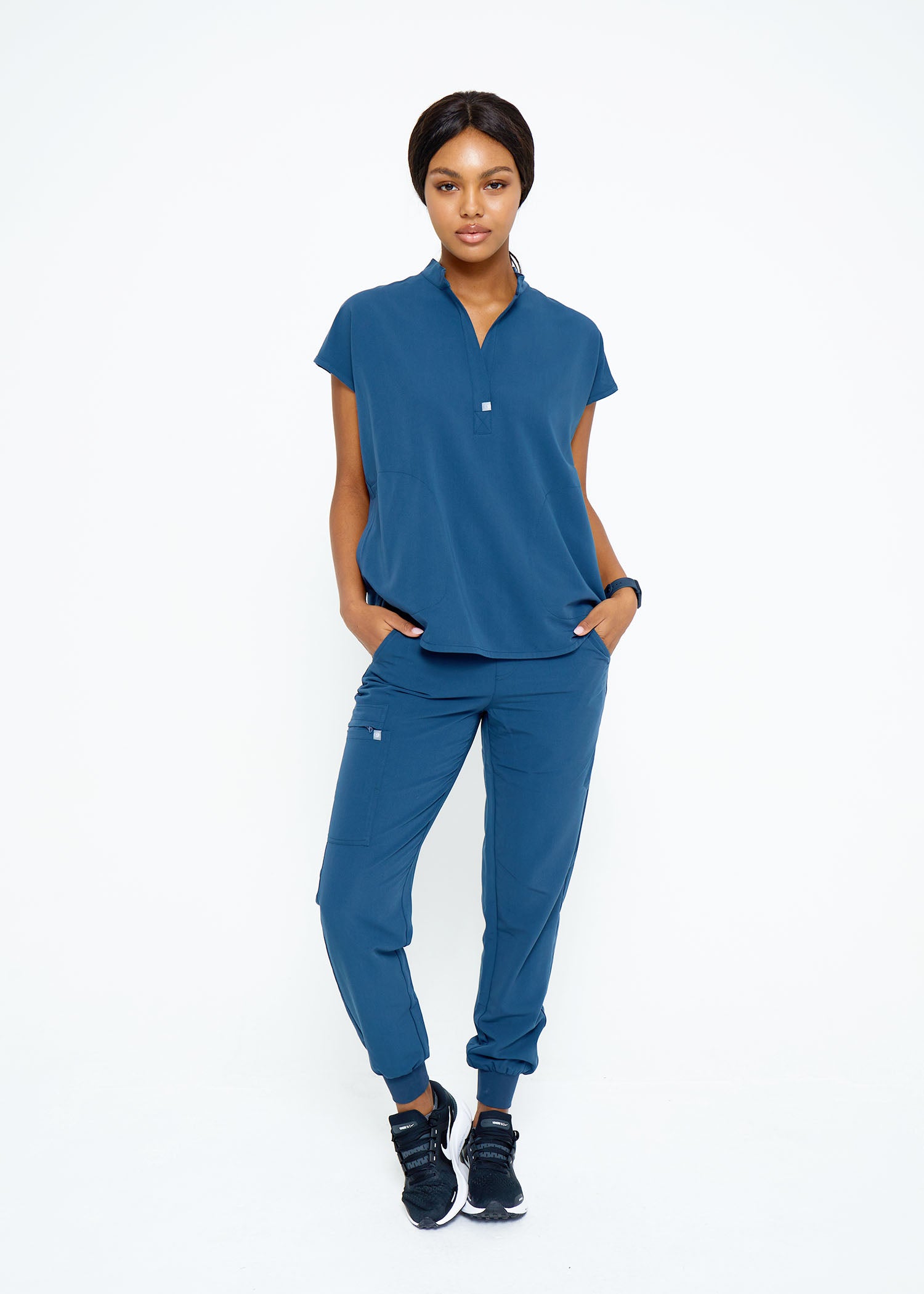 Model wearing scrubs.