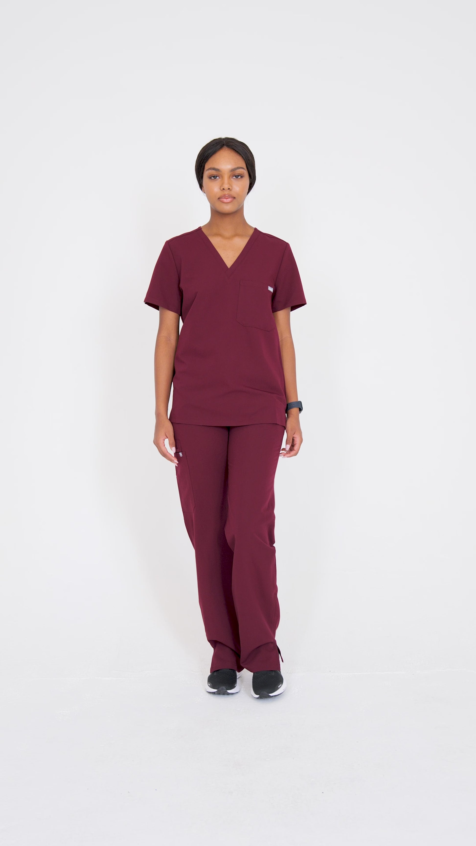Video of model walking in scrubs.