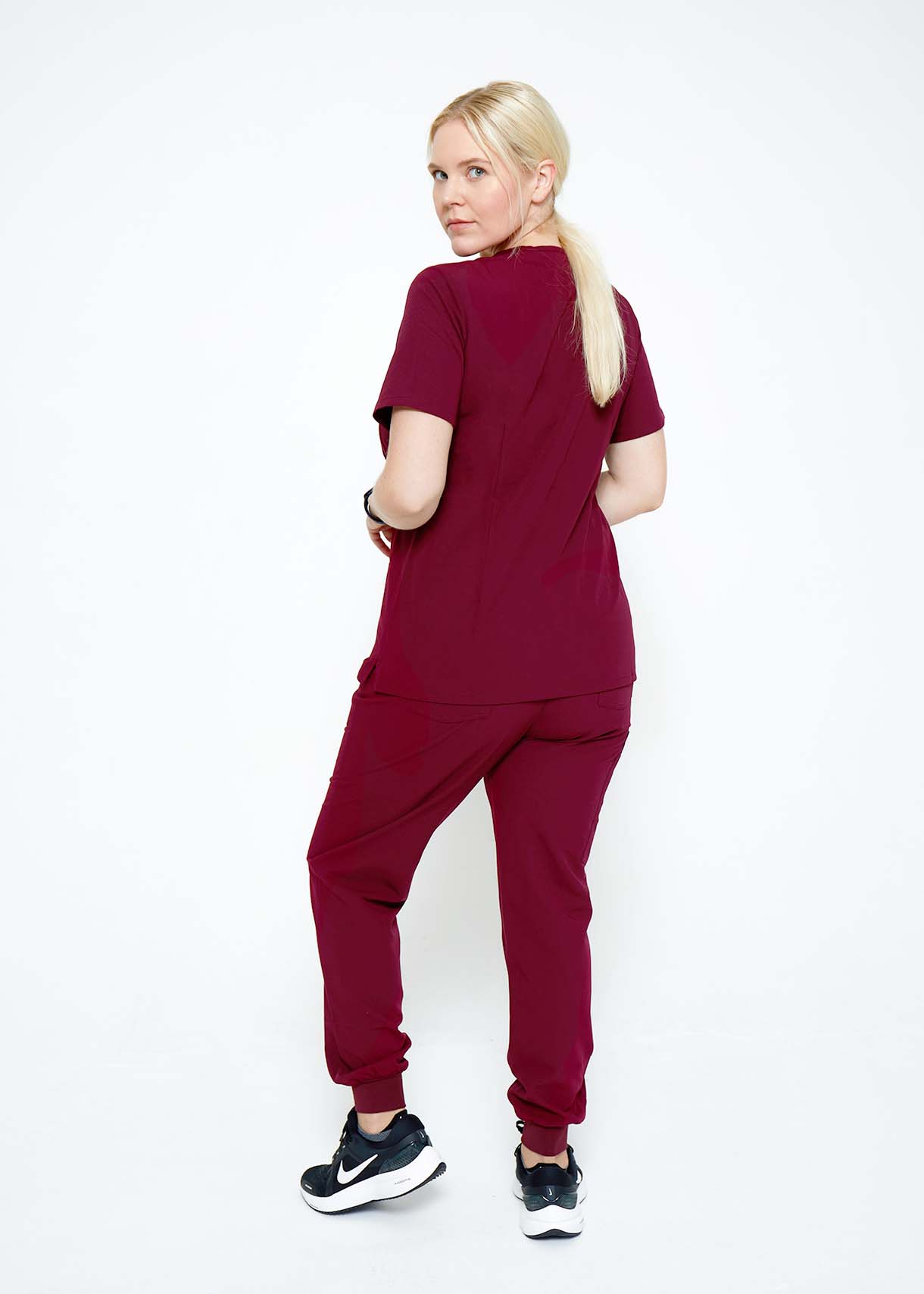 Model wearing scrubs.