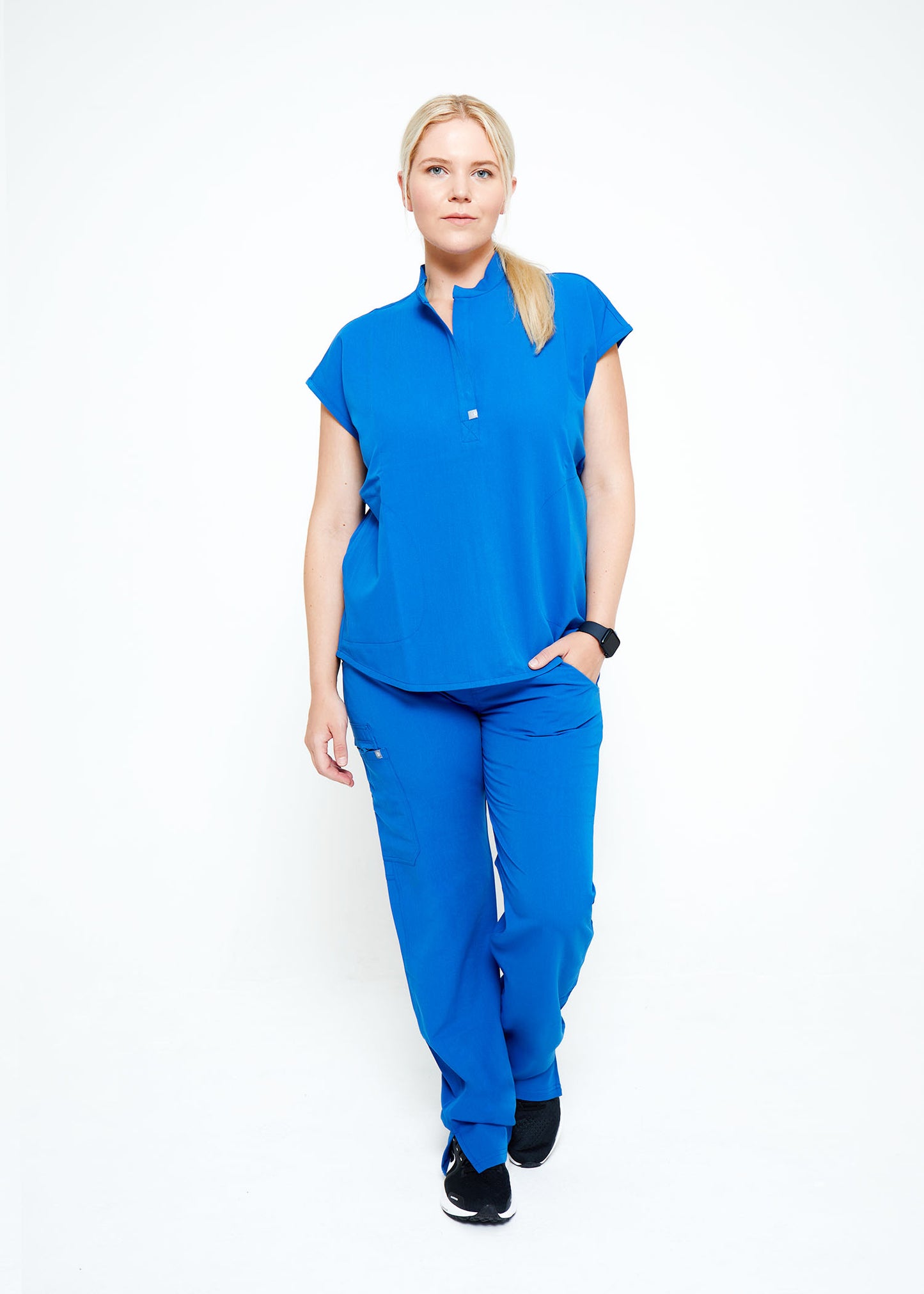Model wearing scrubs.