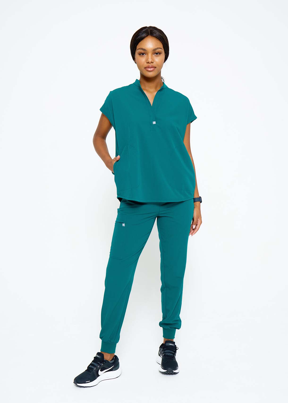 Model wearing scrubs.
