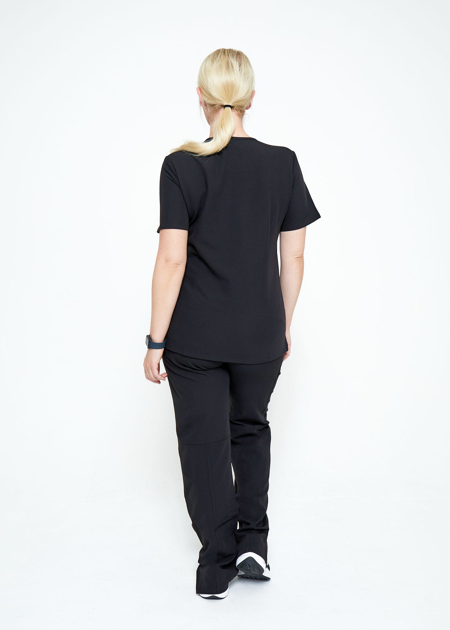 Model wearing scrubs.