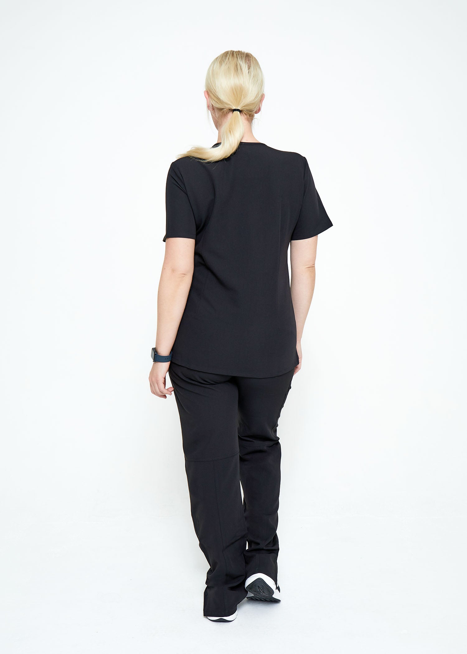 Model wearing scrubs.