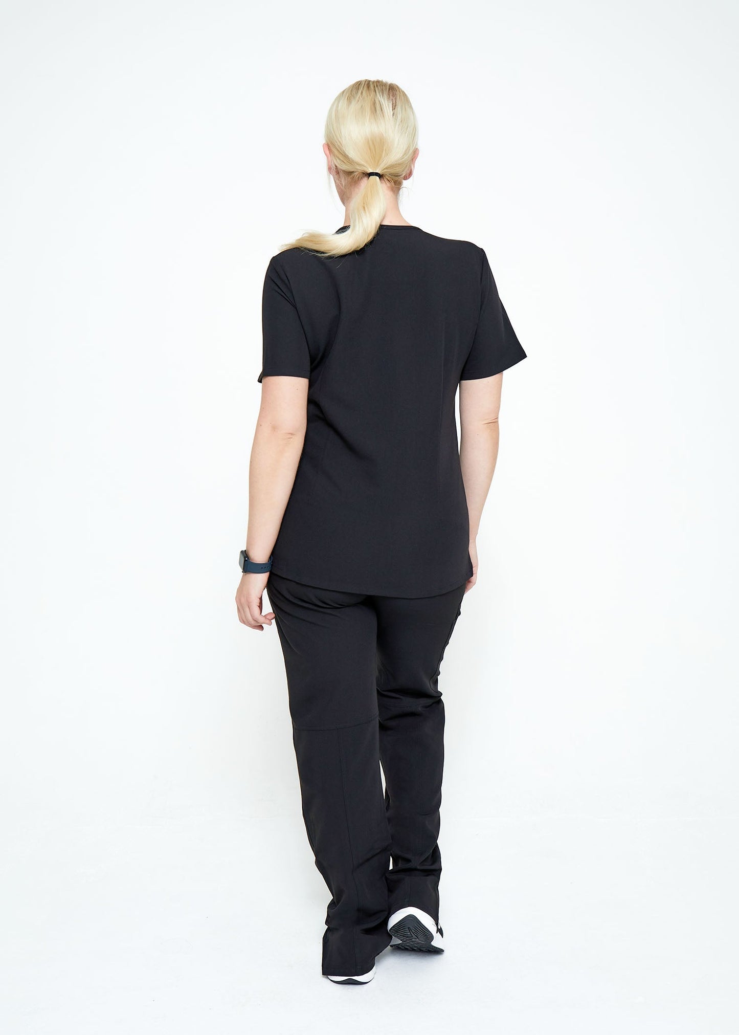 Model wearing scrubs.