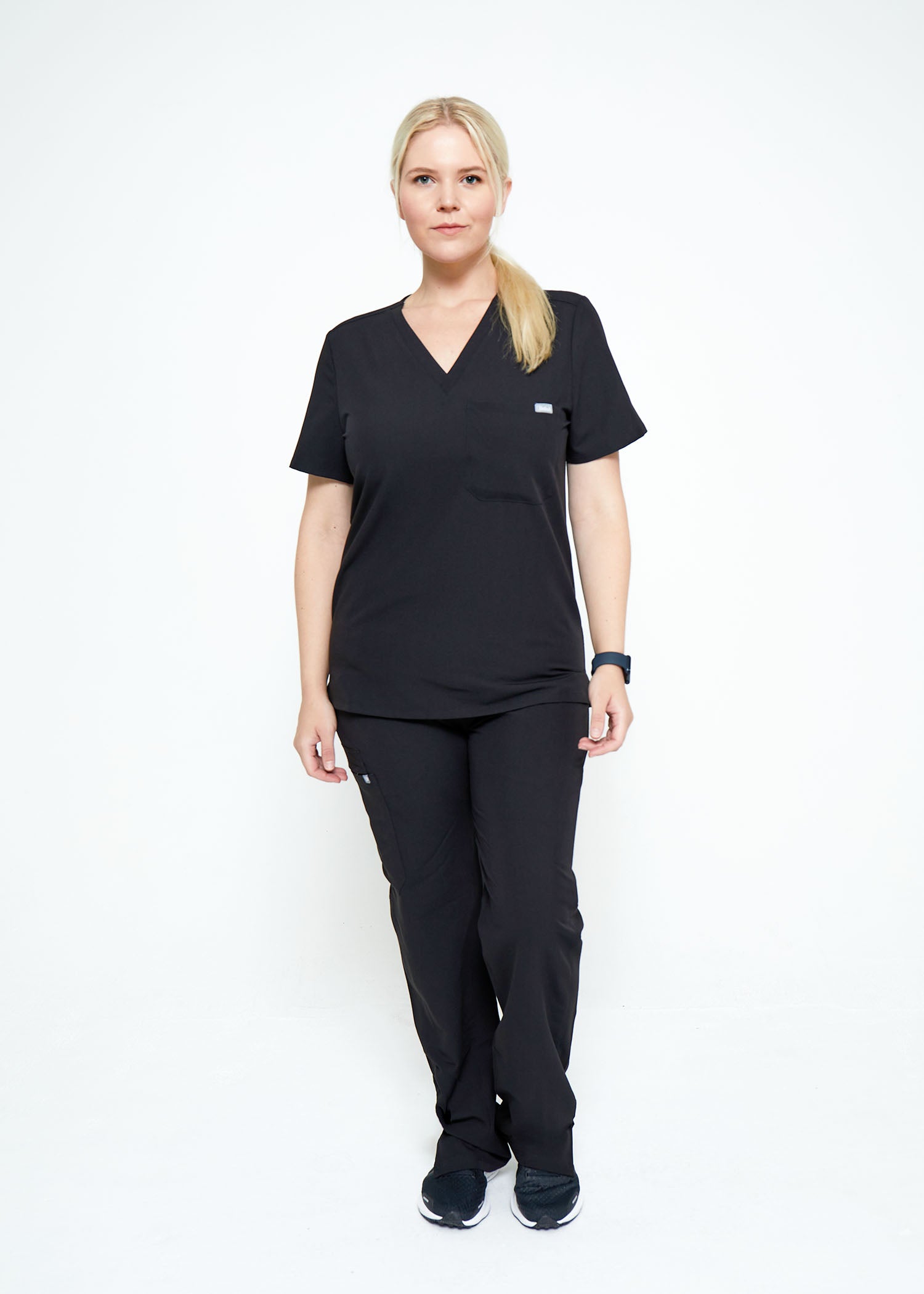 Model wearing scrubs.