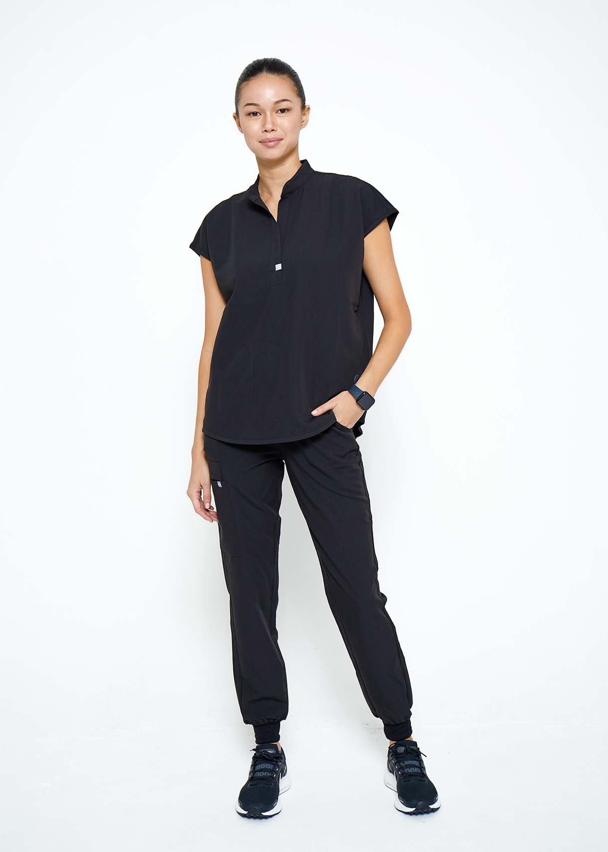 Model wearing scrubs.